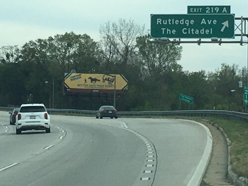 Billboard on the interstate that says "Better Safe Than Sorry" with a runaway horse carriage
